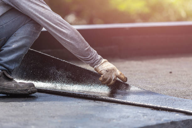 Professional Basement Waterproofing technician working in Lynchburg, VA